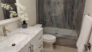 Combined shower/tub, hair dryer, towels, soap