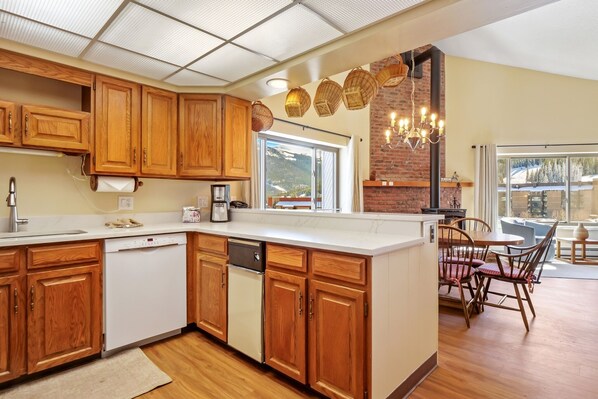 Enjoy cooking in this well-lit kitchen with a large island, oven, and dishwasher.