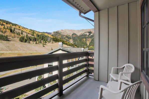 Enjoy breathtaking views of the surrounding mountains from this balcony.