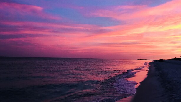 A beach with a calm sea and a sunset sky. - Gulfcrest Townhomes Unit 3 (Destin)
