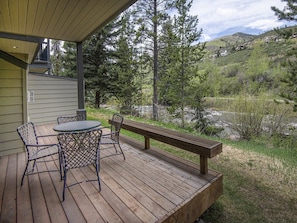 Enjoy a serene outdoor space with a round table and comfortable seating for four.