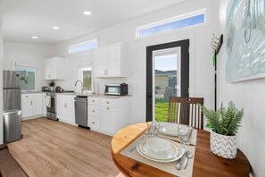 Fridge, microwave, oven, stovetop - Honey Glow Bungalow  | Screened-In Porch, Patio + Yard Games! (Sarasota)