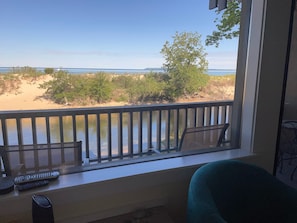 Enjoy breathtaking views of the beach and water from this room's window.