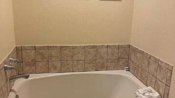 Combined shower/tub, hair dryer, towels, soap