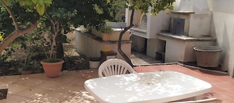 Country house with terrace in the shade of lemon trees