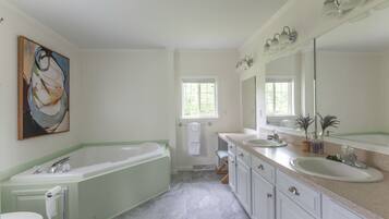 Bathtub, hair dryer, towels, soap