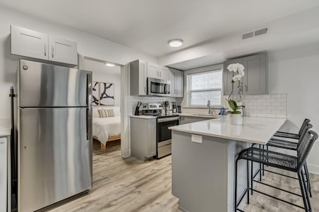 Fridge, microwave, oven, stovetop. LCF Downtown SLC 1BR - Exposed Brick + Mtn Views - Sleeps 4 - A/C + W/D