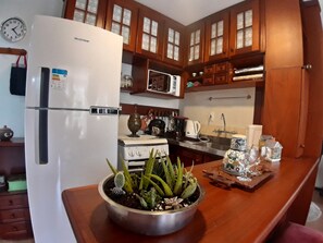 Private kitchen - Agradável Apartamento 2quartos Próximo ao Lago Negro a 4min do Centro (Gramado)