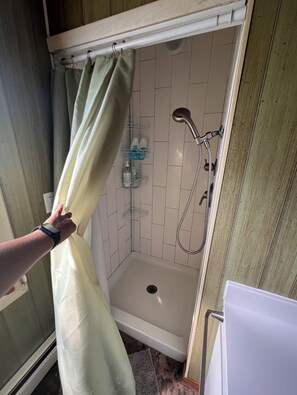 Bathtub, hair dryer, towels, soap