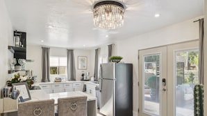A modern kitchen with a central island, stainless steel appliances, and a chandelier. - New! Majestic VIEWS, HIKING, Modern Guest Suite (Sedona)