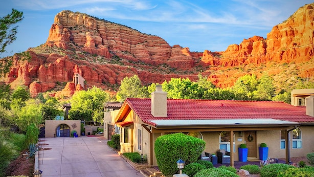 A building with a red-tiled roof, a stone chimney, and a front door with a wreath. - New! Majestic VIEWS, HIKING, Modern Guest Suite (Sedona)