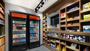 A snack and frozen food display with various brands and products. - Hampton Inn & Suites Marina (Marina)