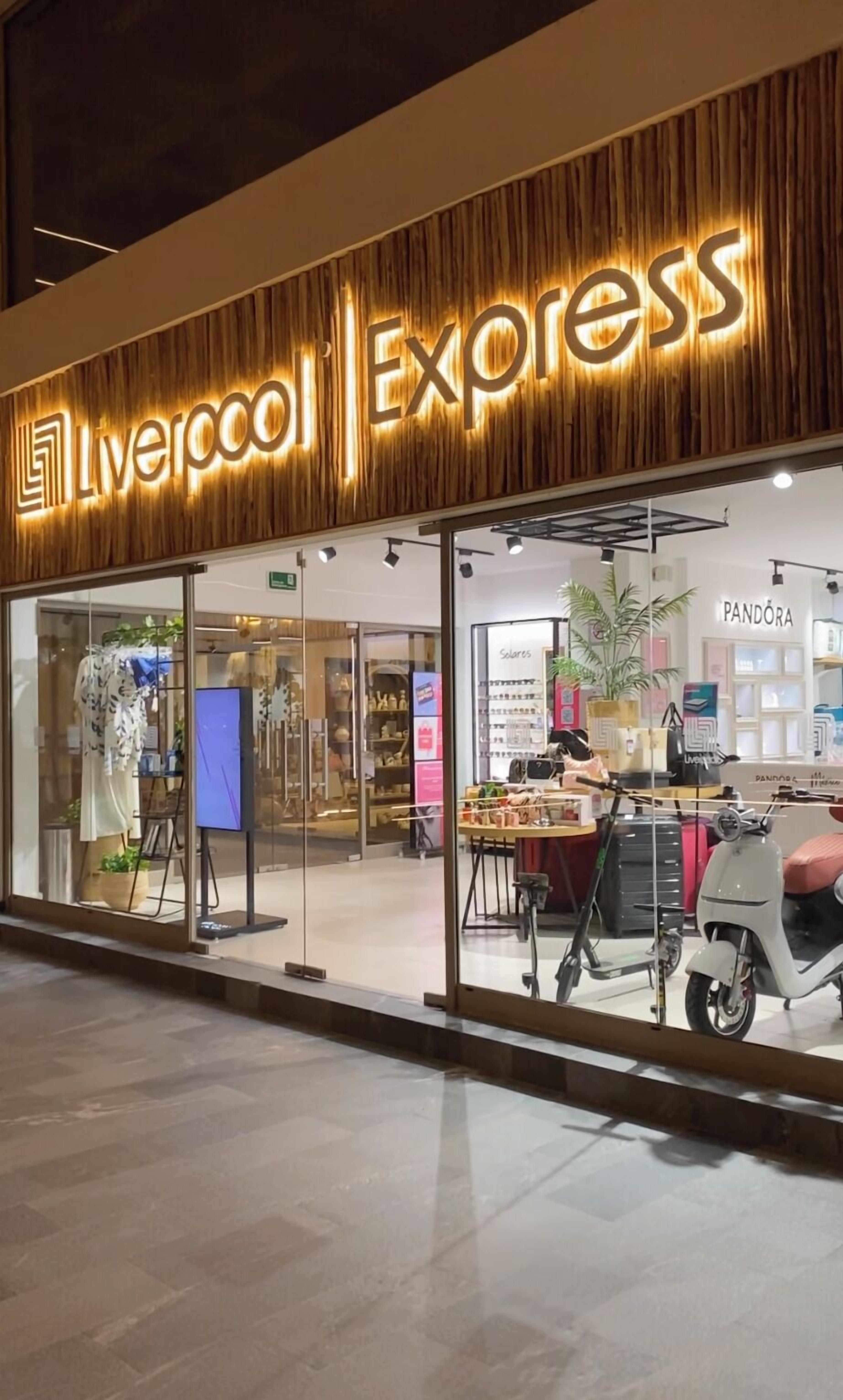 A storefront with a wooden facade and illuminated signage reading "Liverpool Express."