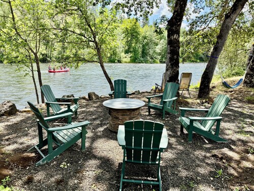 Riverfront Gem with Big Deck, Fishing & Adventure. Comfy beds, upgraded beauty