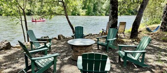 Riverfront Gem with Big Deck, Fishing & Adventure. Comfy beds, upgraded beauty