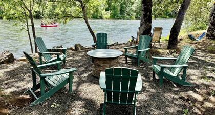 Riverfront Gem with Big Deck, Fishing & Adventure. Comfy beds, upgraded beauty