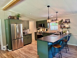 Fridge, microwave, oven, stovetop - Riverfront Gem with Big Deck, Fishing & Adventure. Comfy beds, upgraded beauty (Trail)