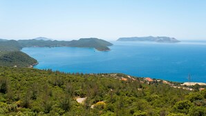A coastal landscape with a clear view of the sea and distant islands. - Golden Rose Suit Pension (Kas)