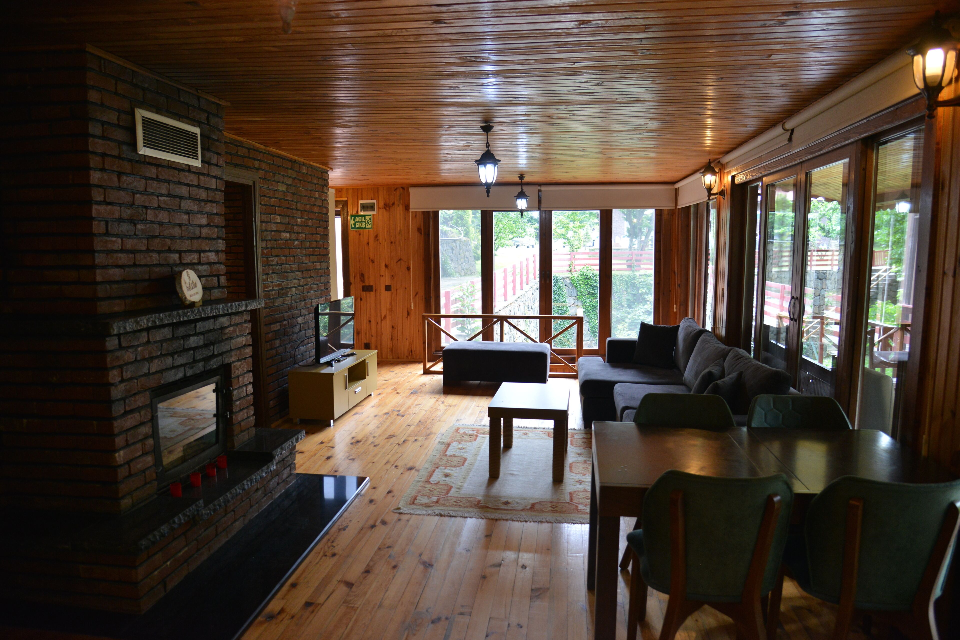 Deluxe Duplex | Living area | 90-inch LCD TV with satellite channels, TV, toys