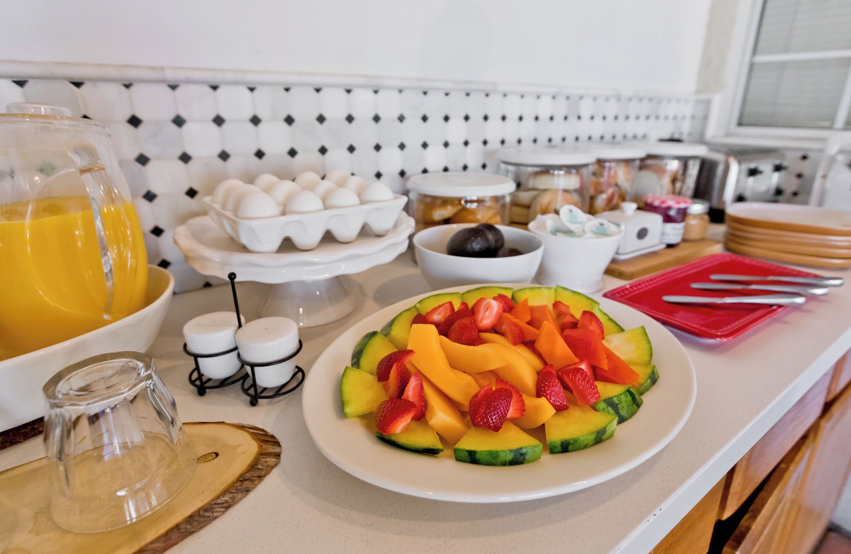 A breakfast buffet with various food items and condiments.