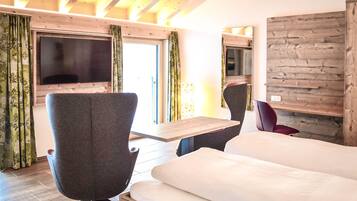 Comfort Studio, 1 Bedroom | Living area | 50-inch flat-screen TV with cable channels, TV
