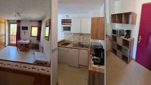 Un espacio habitable compacto con comedor, kitchenette y un baño pequeño.