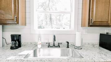 Fridge, coffee/tea maker, cookware/dishes/utensils