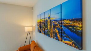 A room with a cityscape painting on the wall, a floor lamp, and a sofa. - Welcome to #BestStayEver Nashville/Old Hickory TN (Nashville)