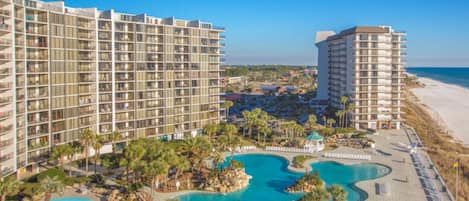 Enjoy beach access and a tranquil pool area surrounded by lush vegetation.