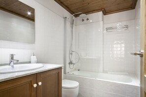 Bathtub, hair dryer, towels