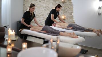Guests can enjoy massages in a serene spa setting with two treatment tables.