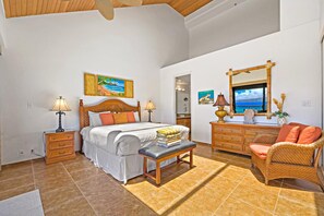 A bedroom with a bed, bedside tables, a bench, a dresser, a chair, and artwork on the walls. - Sands of Kahana | Ocean View 3 BR | Car Incl. w/ 6+ Nights | SOK-292 by KBM (Lahaina)