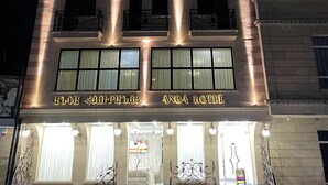 A multi-story hotel with illuminated signage reading "THAI SULTAN ANGHA HOTEL". - Anga Yerevan Hotel (Yerevan)