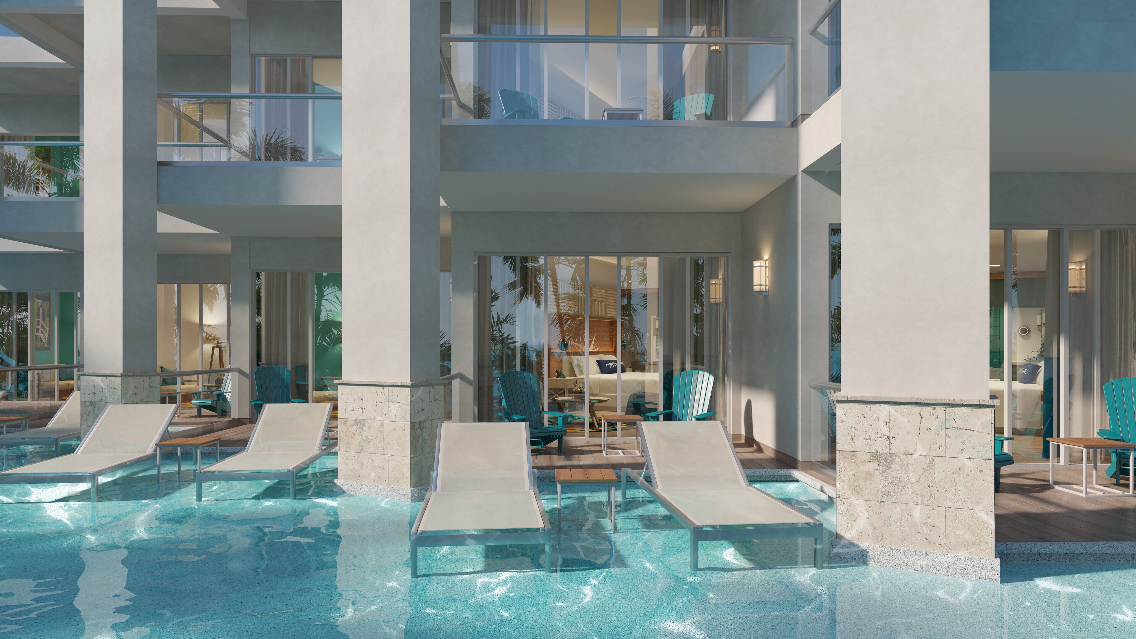 Un hotel moderno con zona de piscina, sillones de descanso y vista al interior.