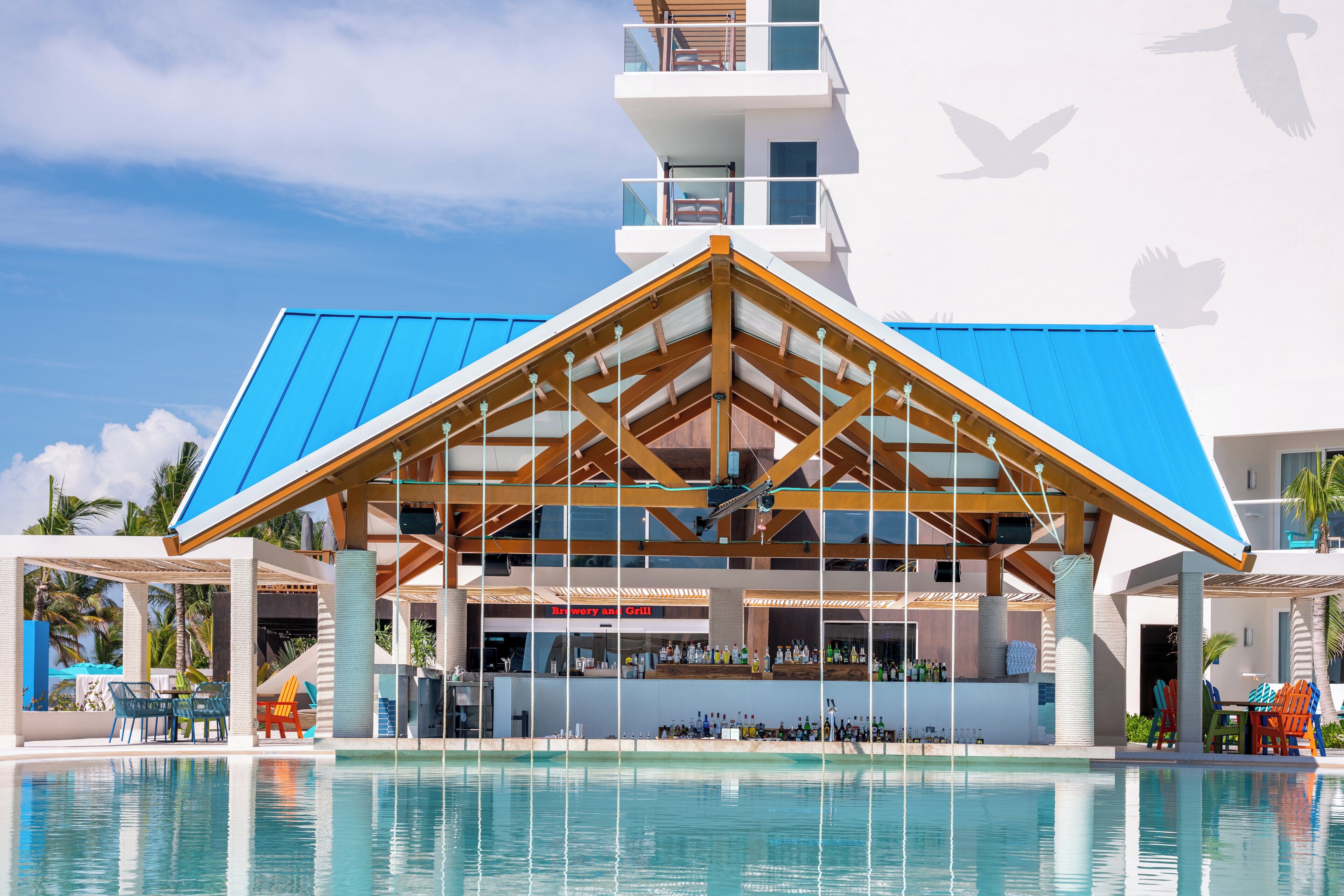 A resort with a swimming pool, a bar, and a restaurant.