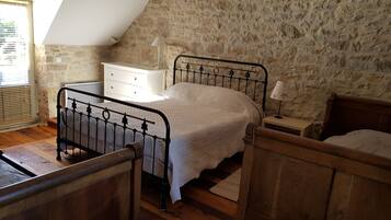 1 bedroom, desk, iron/ironing board, travel crib