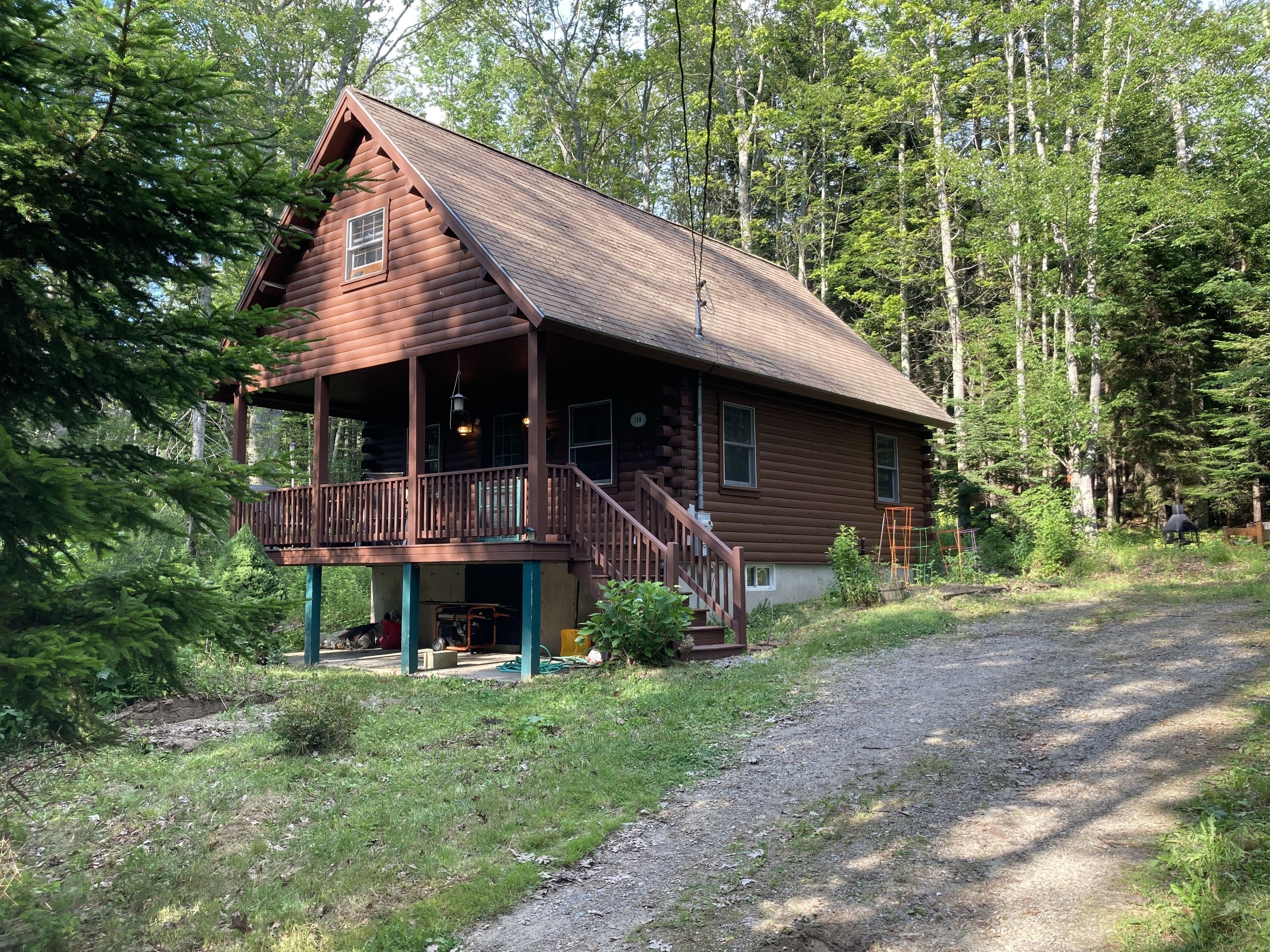 Cozy log cabin!  Enjoy Vacationland at its very best. Beaches, waterfall & trees