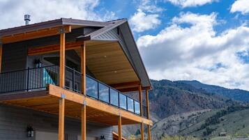 Enjoy expansive views of the surrounding mountains from the two-story building's balcony.
