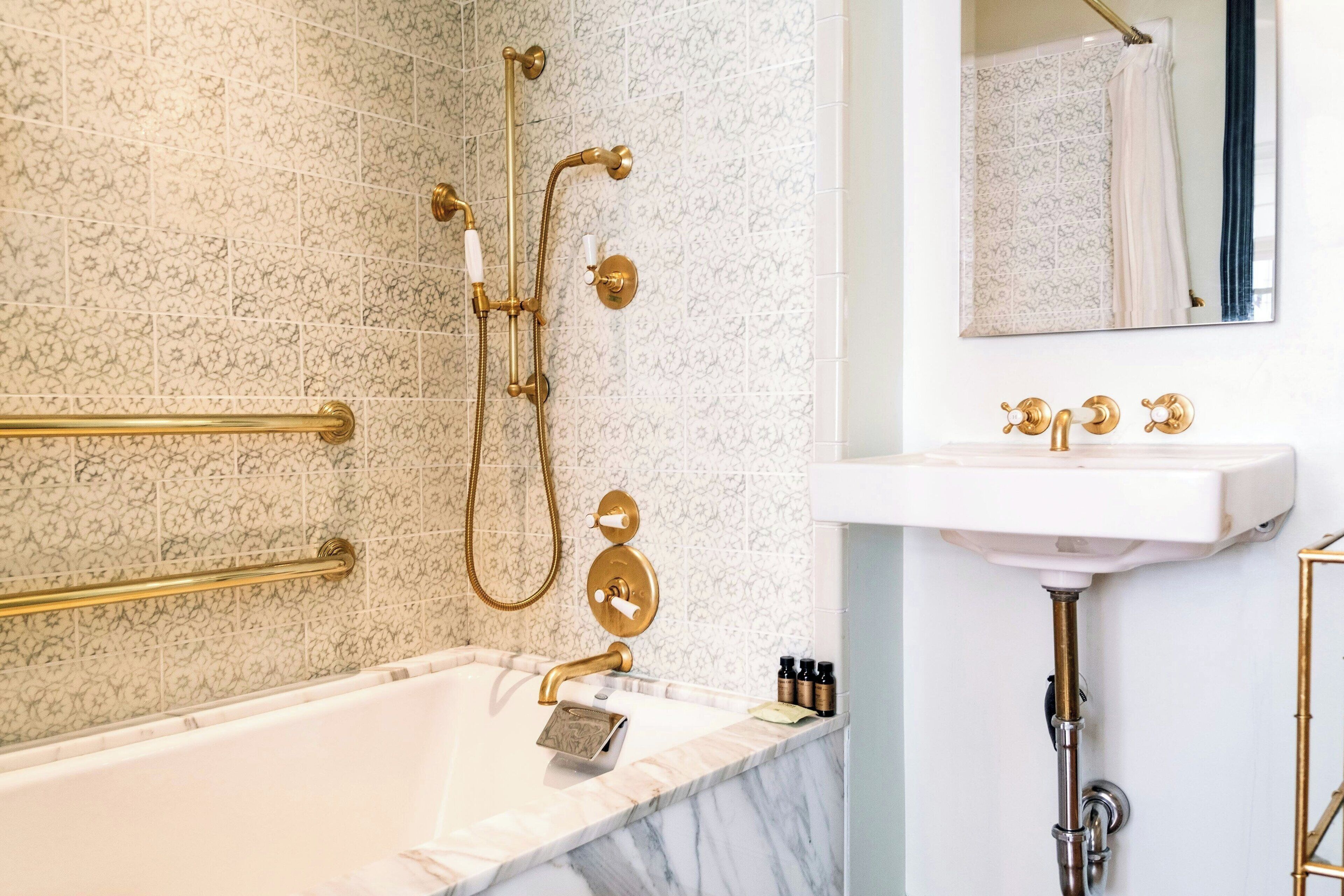 combined shower/bathtub, designer toiletries, hair dryer, bathrobes