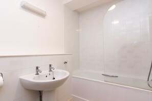 Apartment, Multiple Beds | Bathroom | Combined shower/tub, deep soaking tub, hair dryer, towels - Fremington Court, Coventry - 2 Bedroom Apartment (Coventry)