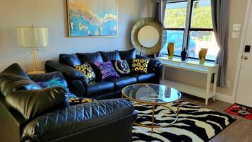 Smart TV, fireplace, books, printers