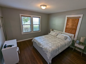 Enjoy a restful stay in this cozy room with a single bed, desk, and two windows.