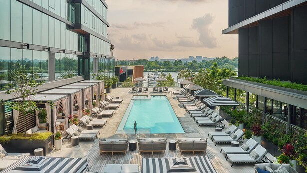 A rooftop pool area with lounge chairs and a swimming pool. - Pendry Washington DC - The Wharf (Washington)