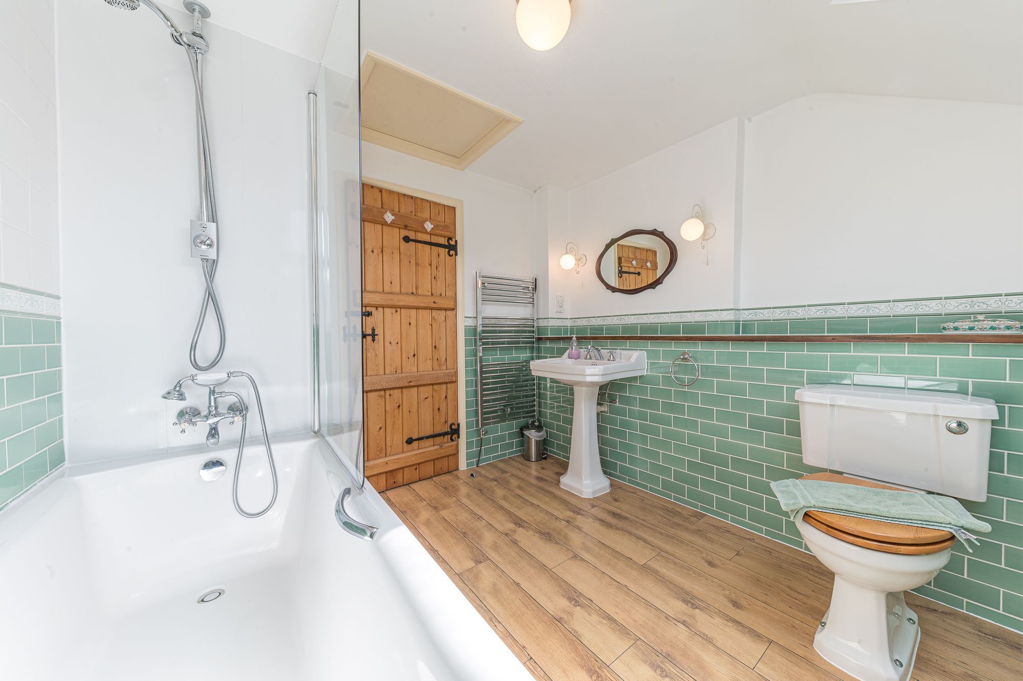 A bathroom with a bathtub, a sink, and a toilet.