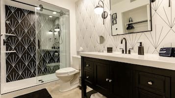 Shower, hair dryer, towels, soap