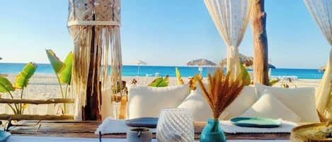 On the beach, sun loungers