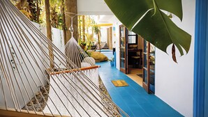 A hammock, a blue floor, and a room with a door. - Spacious 2BR w/ Pool •  Walk to Beach & Town • Quiet area (Sayulita)