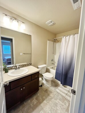Combined shower/tub, hair dryer, towels, soap