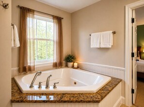 Combined shower/tub, jetted tub, hair dryer, towels