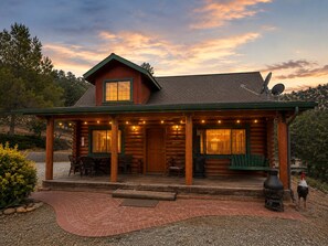 A log cabin with a porch, outdoor seating, and a satellite dish. - Bodfish Ranch/ sleeps 14 / secluded on 3.5 acres (Bodfish)